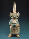 "The garment worn by this figure is believed to represent the quilted armor worn by warriors, but the elaboration of the costume and its accoutrements suggest a figure of high rank and noble status." Costumed Figure, 7th–8th century -- Mexico; Maya Ceramic, pigment; H. 11 17/32 in. (29.3 cm) (1979.206.953) – Metropolitan Museum of Art Note the pectoral ("breast plate"). Note that this figure post-dates the Nephite period.