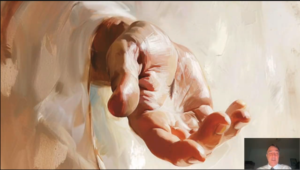  Close-up painting of Jesus’s outstretched hand, palm upward, with a wound visible in the palm.